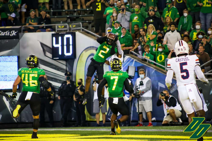 Mykael Wright (2) intercepts a pass intended for Stanley Berryhill (1) in the end zone.